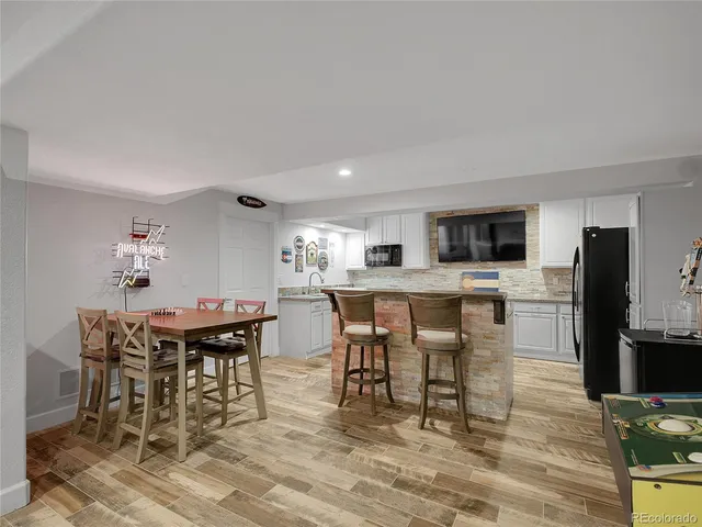 walk in closet with wooden floor