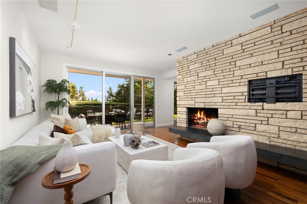 598 Camillo Road Sierra Madre, CA 91024 - Photo 19 of 75 a living room with furniture fireplace and a flat screen tv