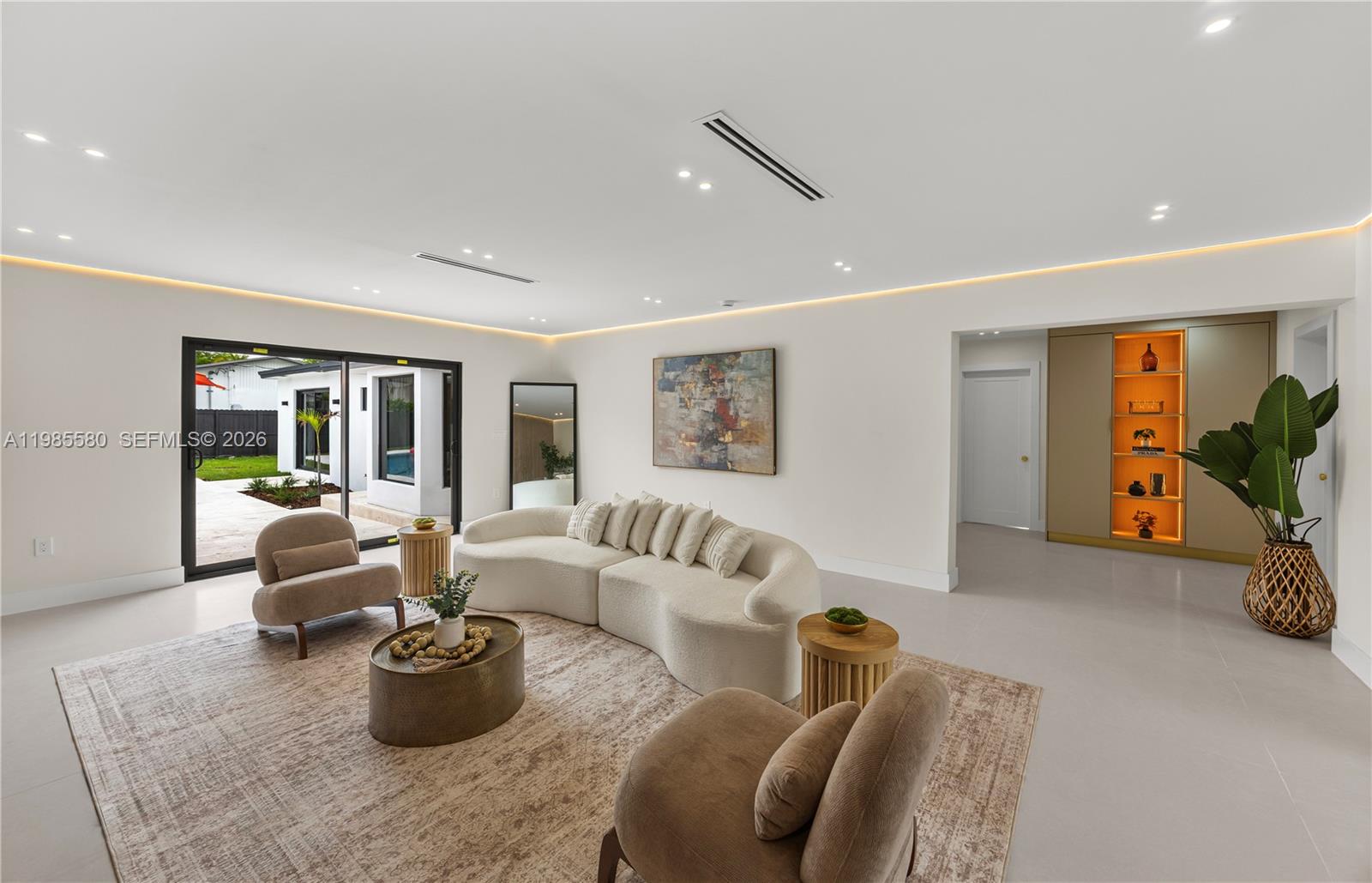 9261 Southwest 80th Terrace Miami, FL 33173 - Photo 20 of 58 a living room with furniture potted plant and a window