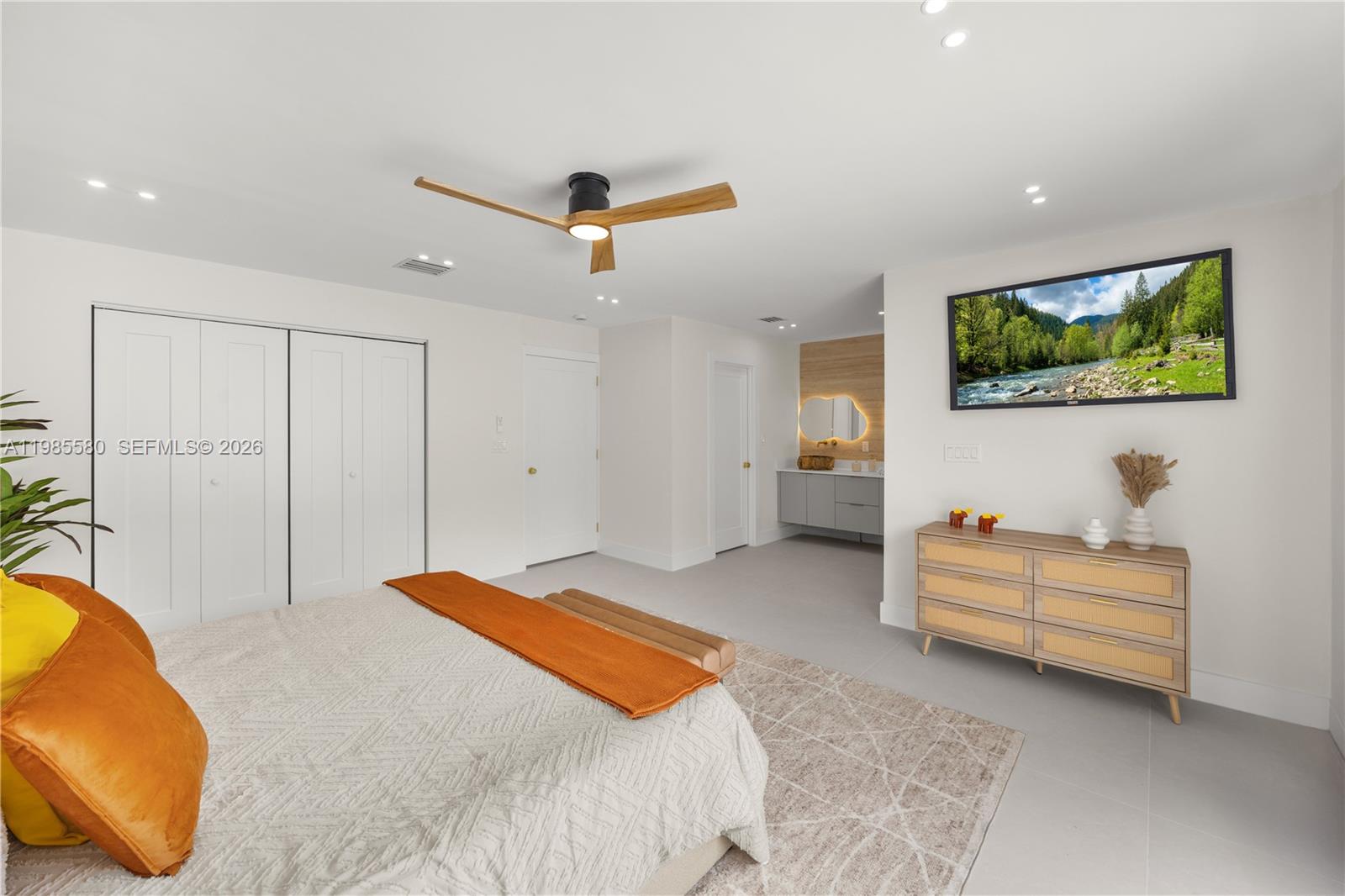 9261 Southwest 80th Terrace Miami, FL 33173 - Photo 25 of 58 a bedroom with a bed and a flat screen tv