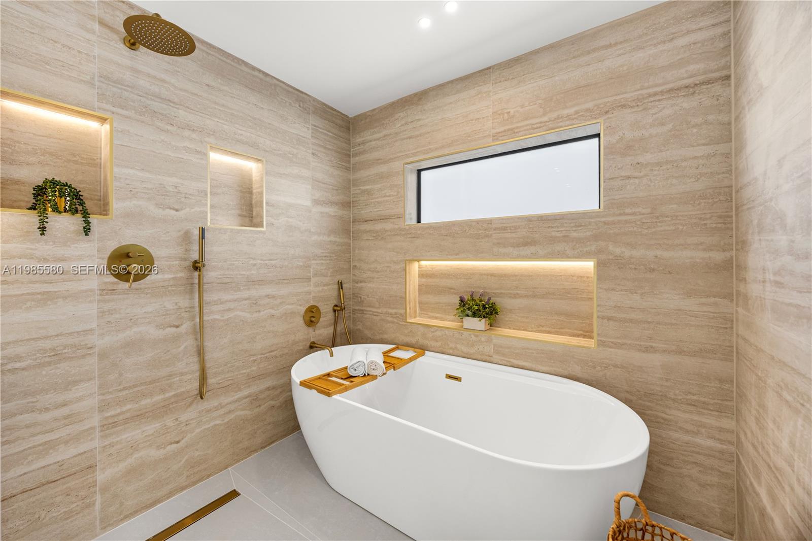9261 Southwest 80th Terrace Miami, FL 33173 - Photo 27 of 58 a bathroom with a bathtub and shower