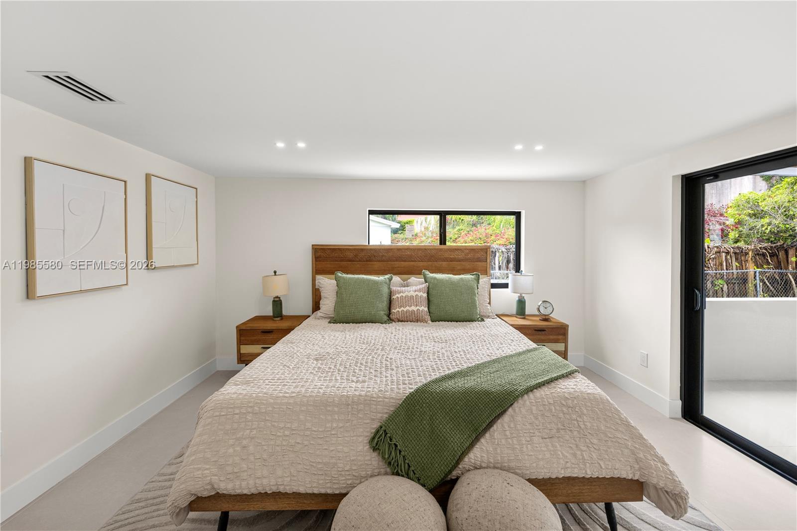9261 Southwest 80th Terrace Miami, FL 33173 - Photo 29 of 58 a bedroom with a bed and window