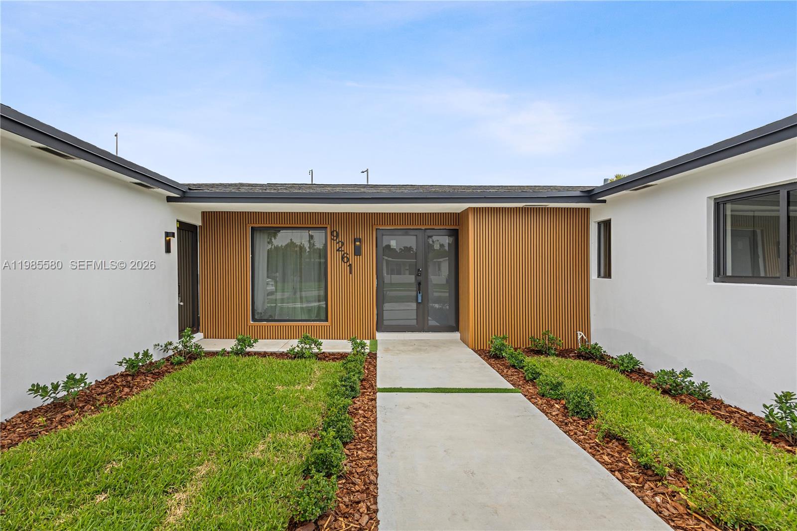 9261 Southwest 80th Terrace Miami, FL 33173 - Photo 3 of 58 a front view of house with yard