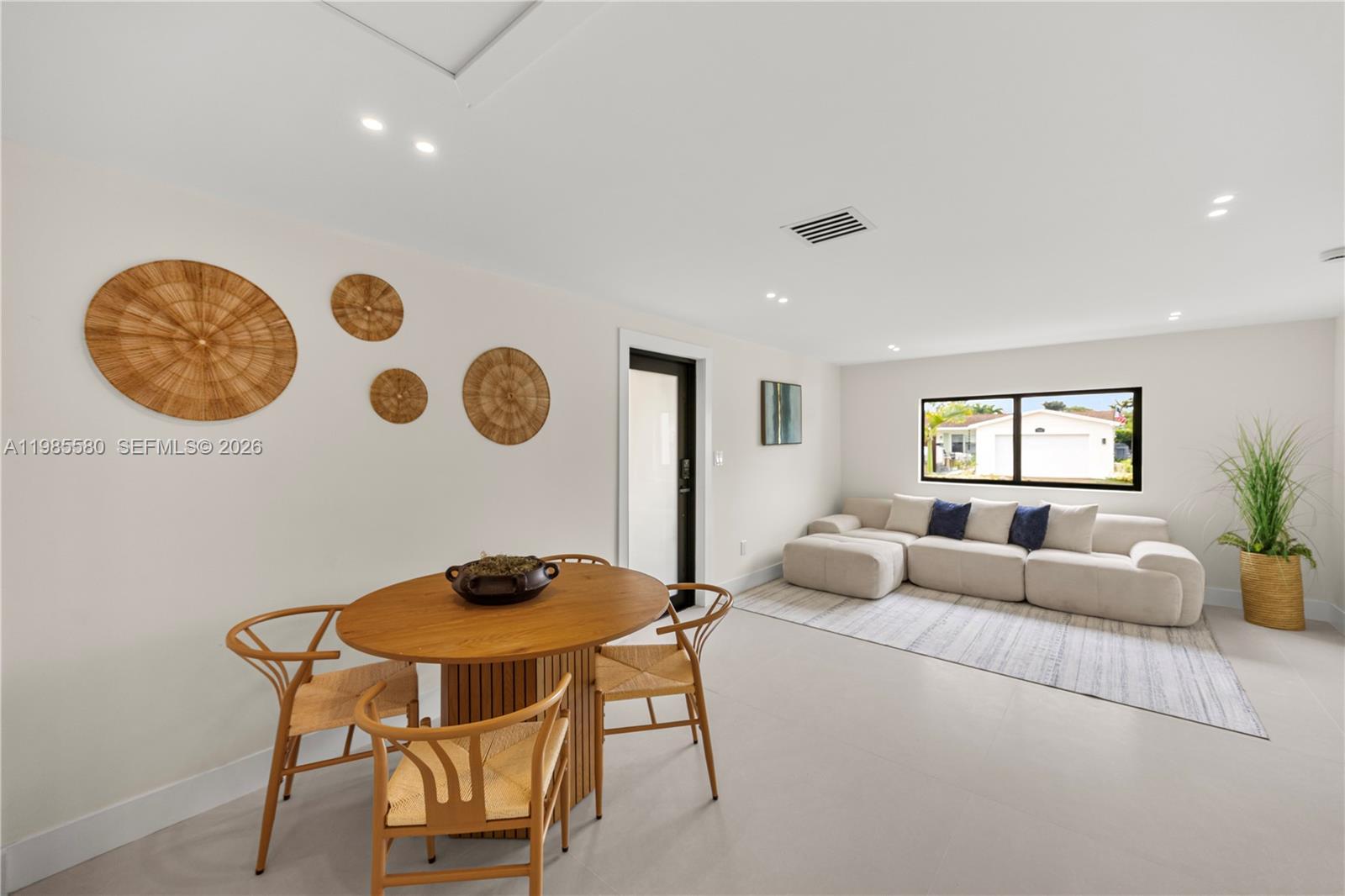 9261 Southwest 80th Terrace Miami, FL 33173 - Photo 36 of 58 a living room with furniture and a window