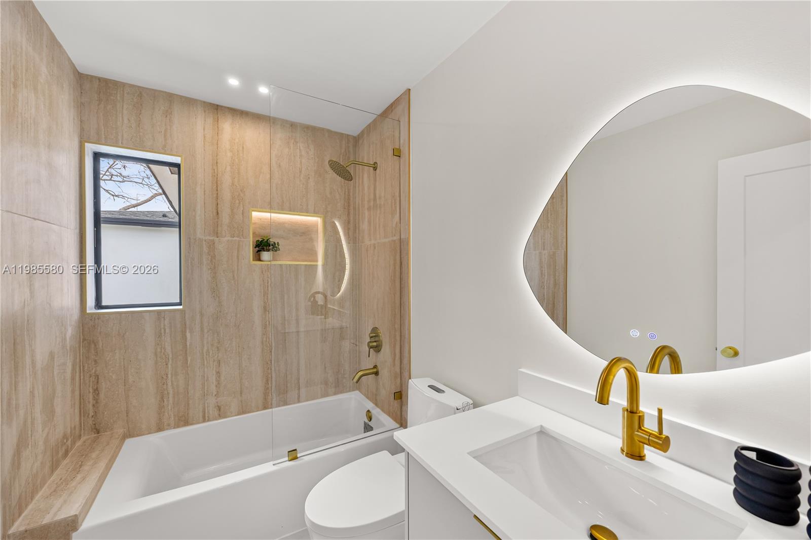 9261 Southwest 80th Terrace Miami, FL 33173 - Photo 45 of 58 a bathroom with a sink and a mirror