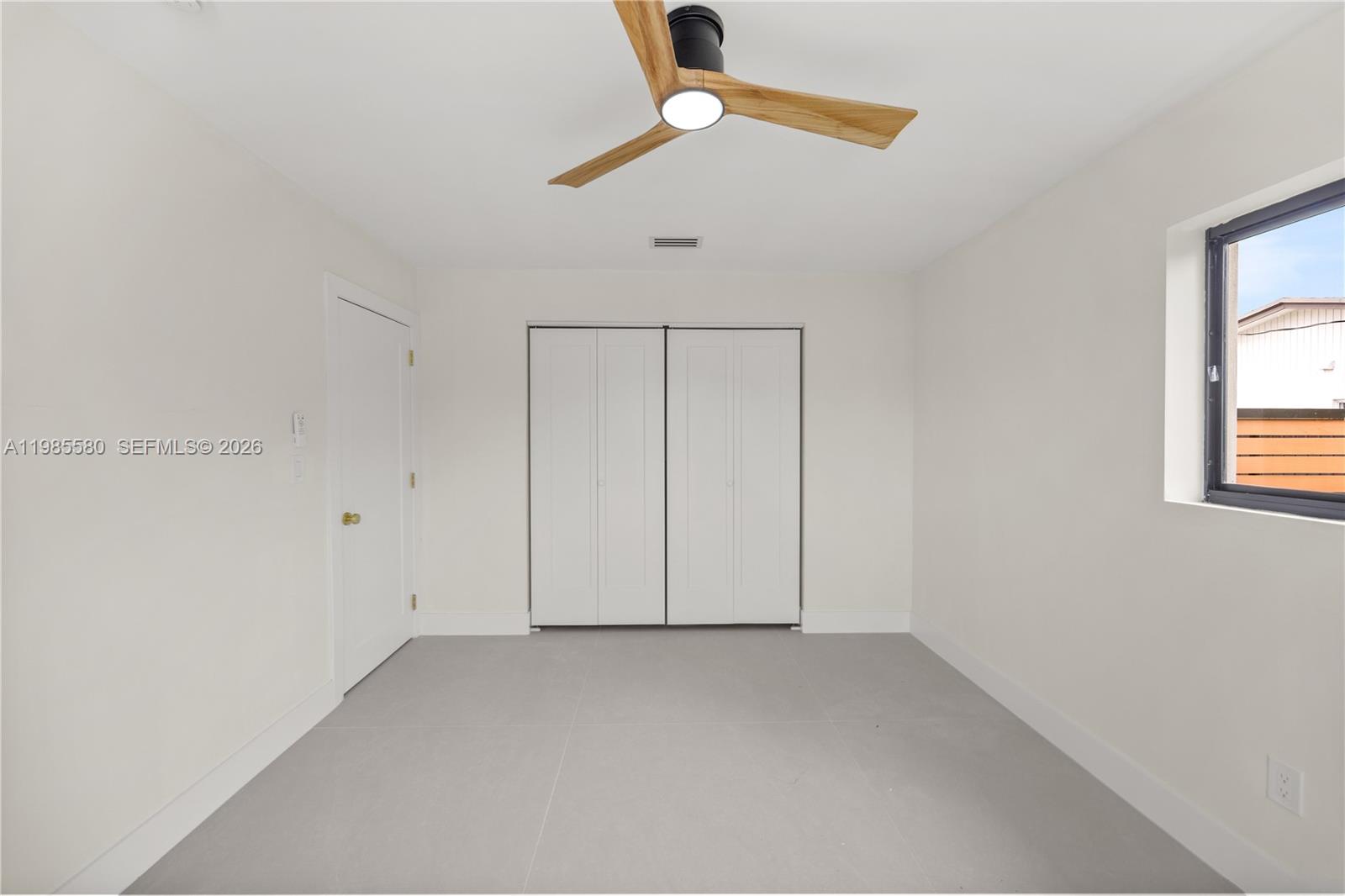 9261 Southwest 80th Terrace Miami, FL 33173 - Photo 49 of 58 an empty room with a window