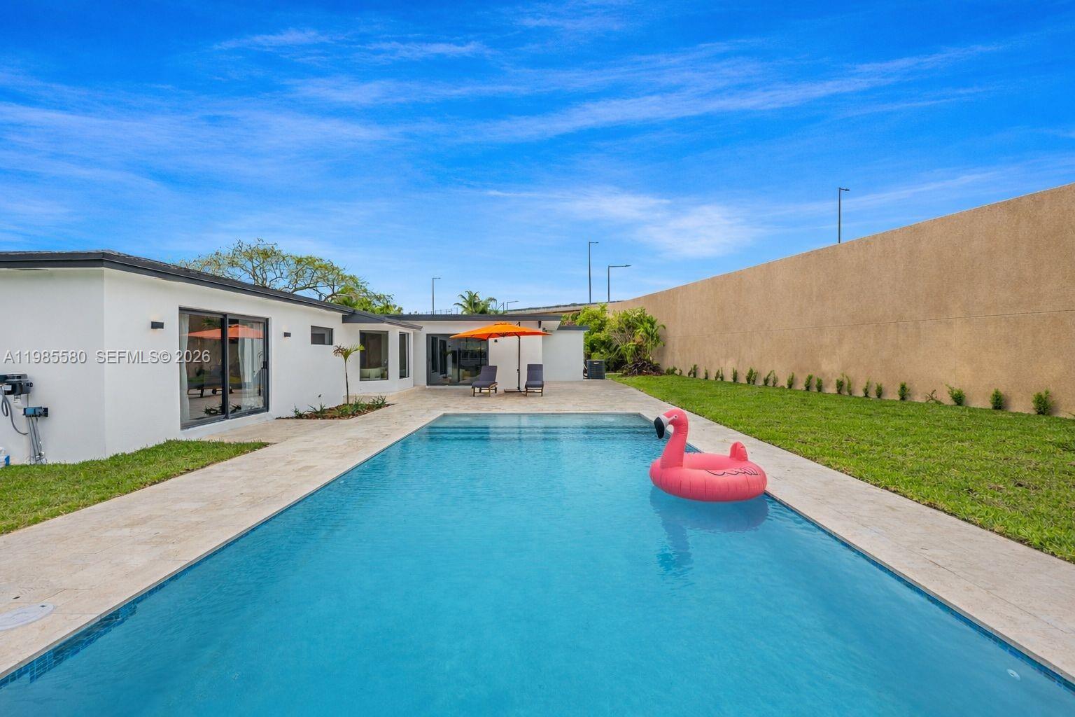 9261 Southwest 80th Terrace Miami, FL 33173 - Photo 56 of 58 a backyard of a house with table and chairs