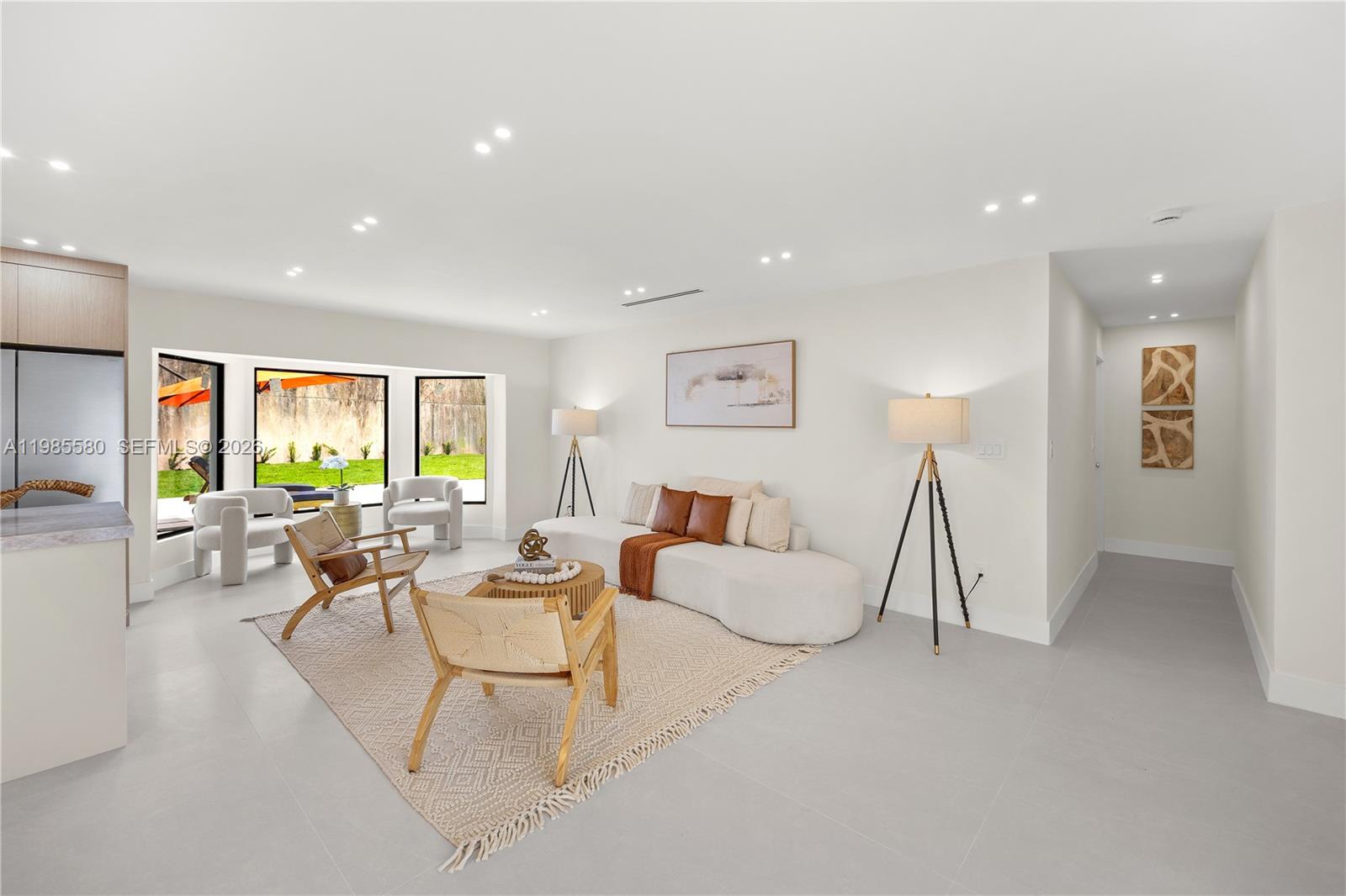 9261 Southwest 80th Terrace Miami, FL 33173 - Photo 8 of 58 a living room with furniture and a wooden floor