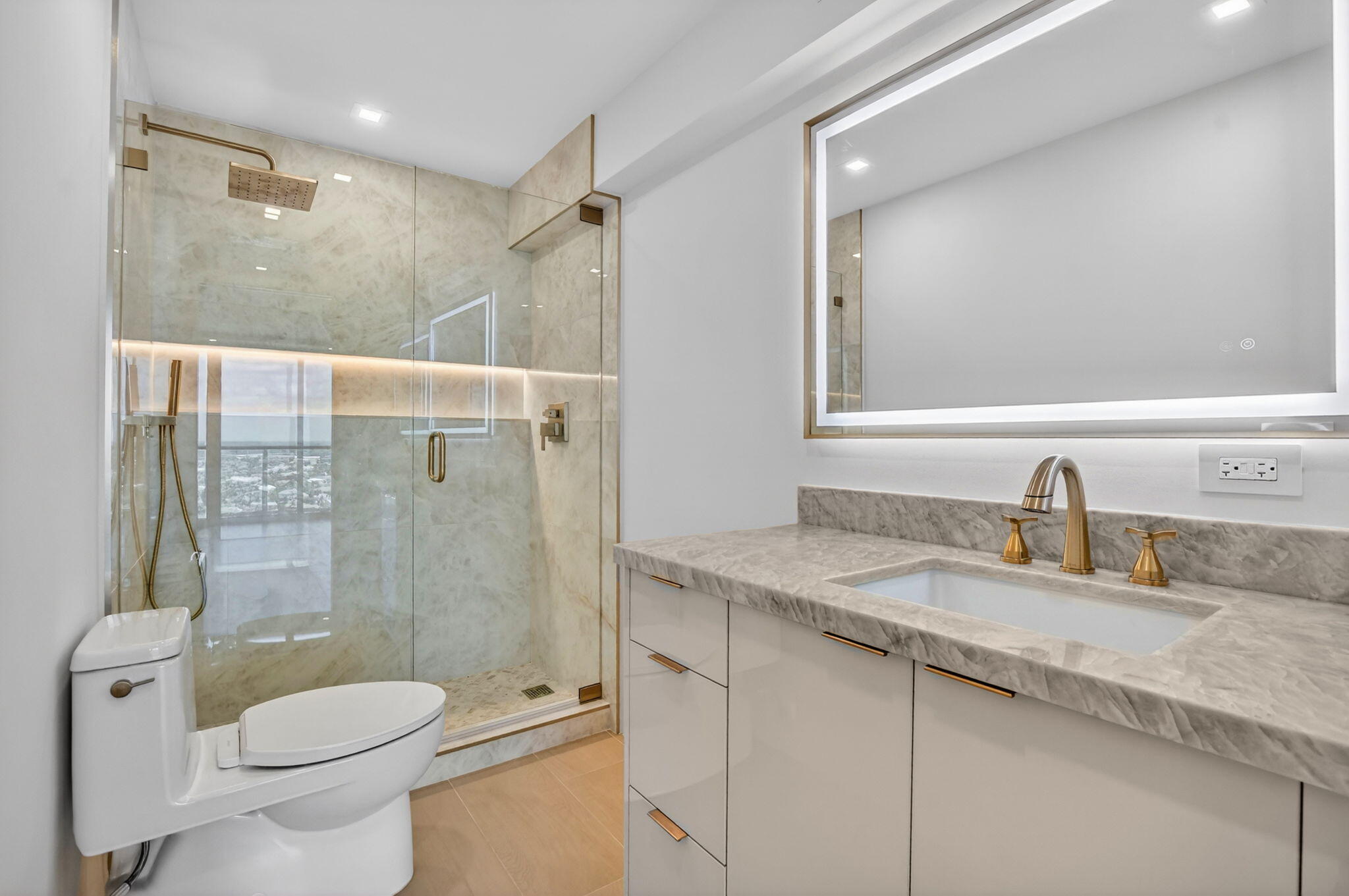 2800 South Ocean Boulevard, Unit 23C Boca Raton, FL 33432 - Photo 31 of 50 a bathroom with a granite countertop sink toilet and shower