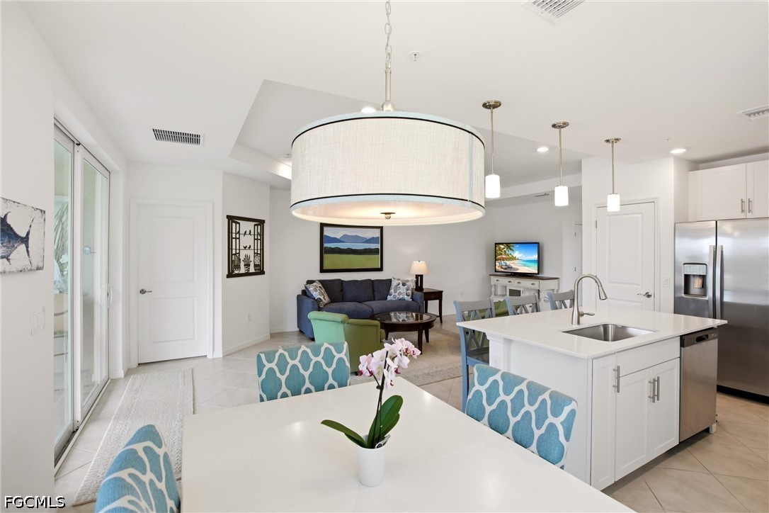 3751 Pebblebrook Ridge Court, Unit 101 Fort Myers, FL 33905 - Photo 17 of 48 a very nice looking dining room with a table and chairs