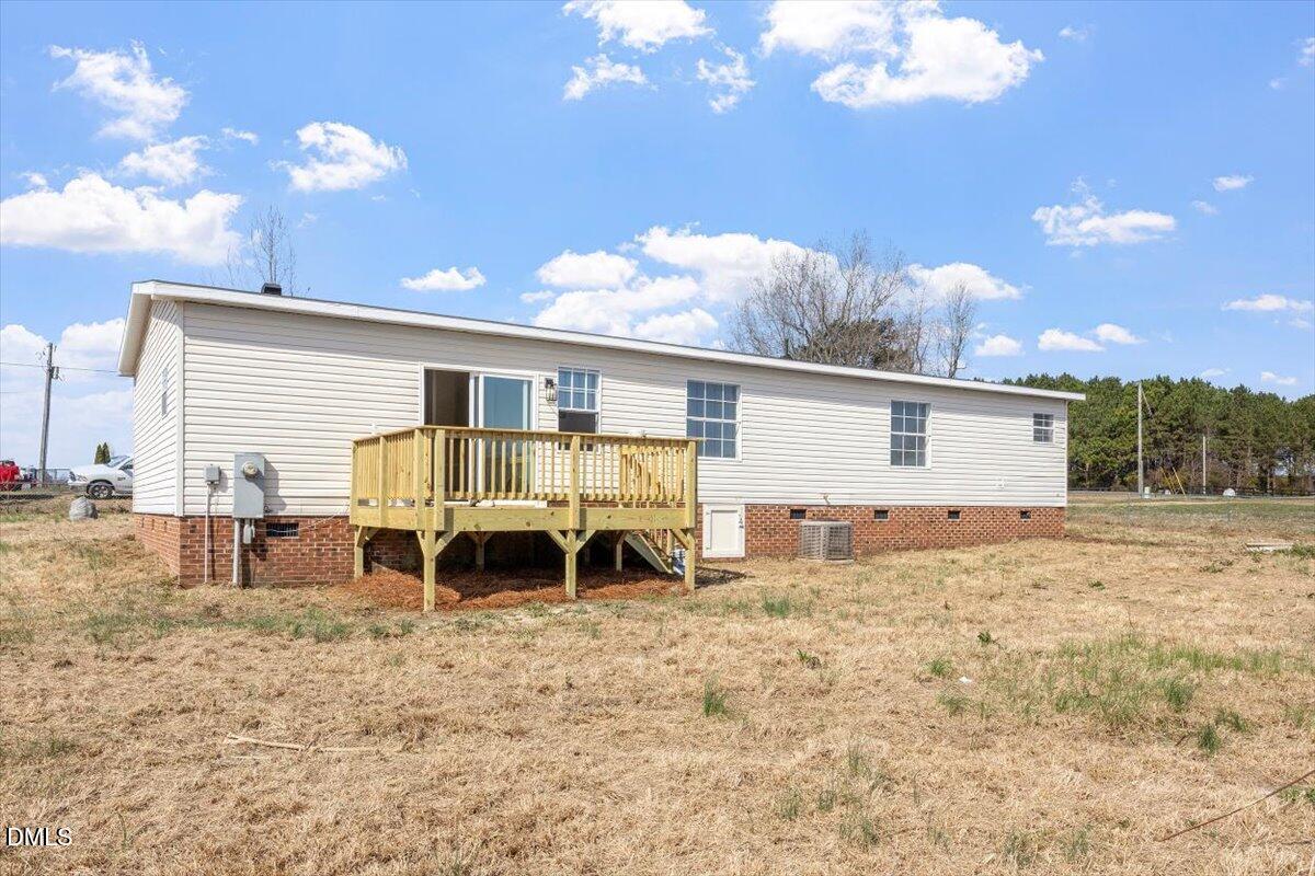 10965 Beaver Dam Road Middlesex, NC 27557 - Photo 19 of 24 a view of a house with backyard and sitting area