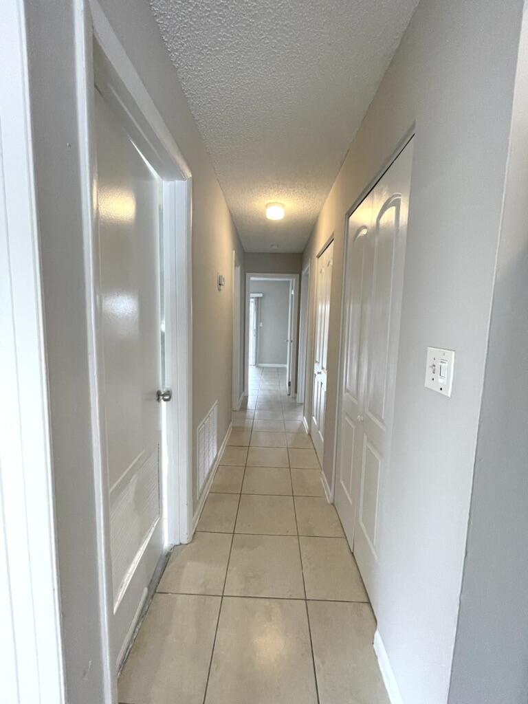 6140 Southwest 3rd Street Margate, FL 33068 - Photo 9 of 24 Hallway to Bedrooms