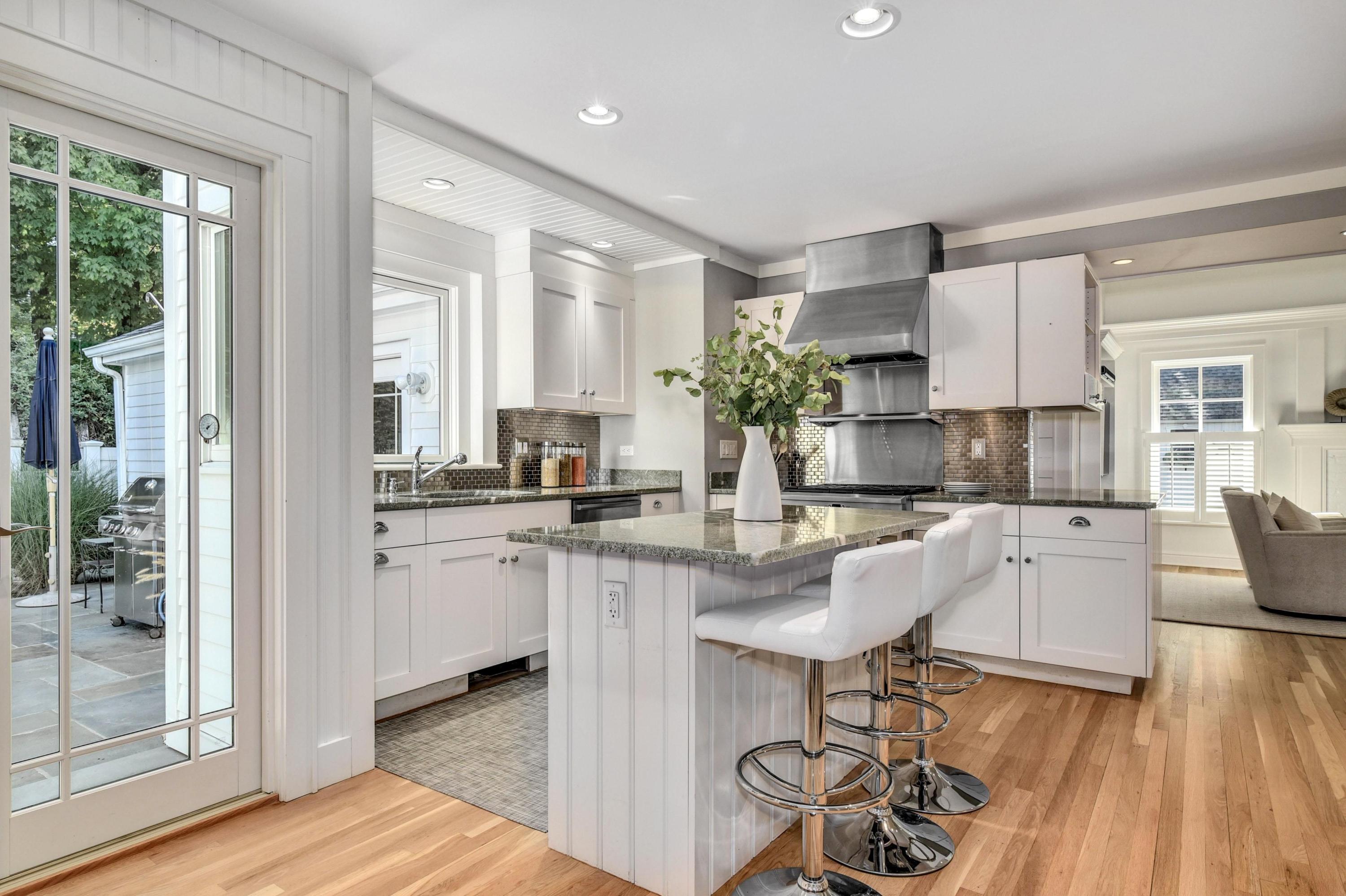 2269 Boston Post Road Darien, CT 06820 - Photo 8 of 39 a kitchen with sink cabinets and dining table chair