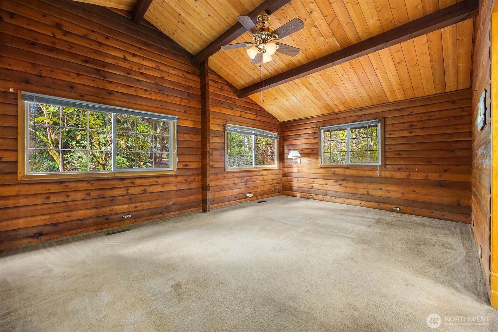 10862 Falk Road Northeast Bainbridge Island, WA 98110 - Photo 20 of 34 a view of an empty room with a window