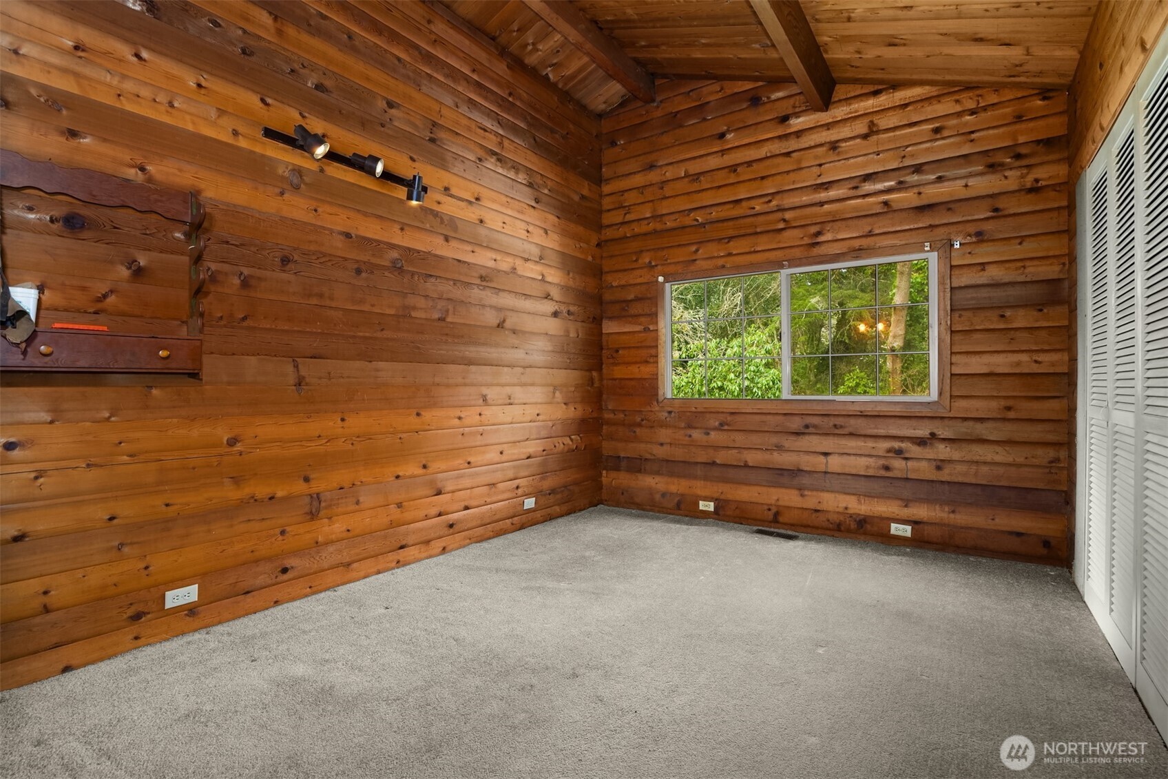 10862 Falk Road Northeast Bainbridge Island, WA 98110 - Photo 22 of 34 a view of a room with a wooden roof