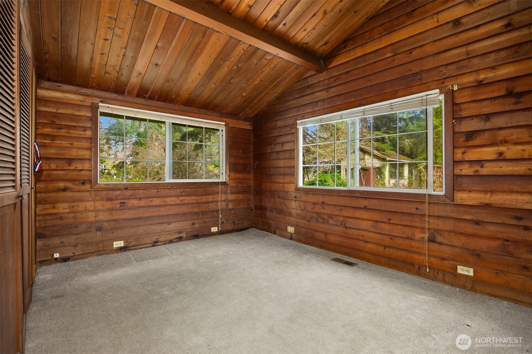 10862 Falk Road Northeast Bainbridge Island, WA 98110 - Photo 24 of 34 a view of an empty room with a window