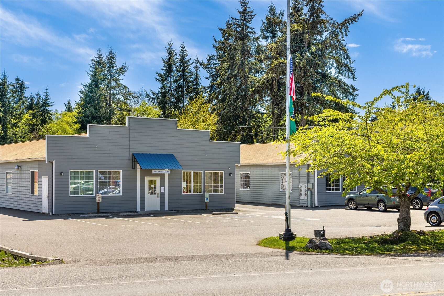 10862 Falk Road Northeast Bainbridge Island, WA 98110 - Photo 34 of 34 a street sign on a sidewalk next to a road