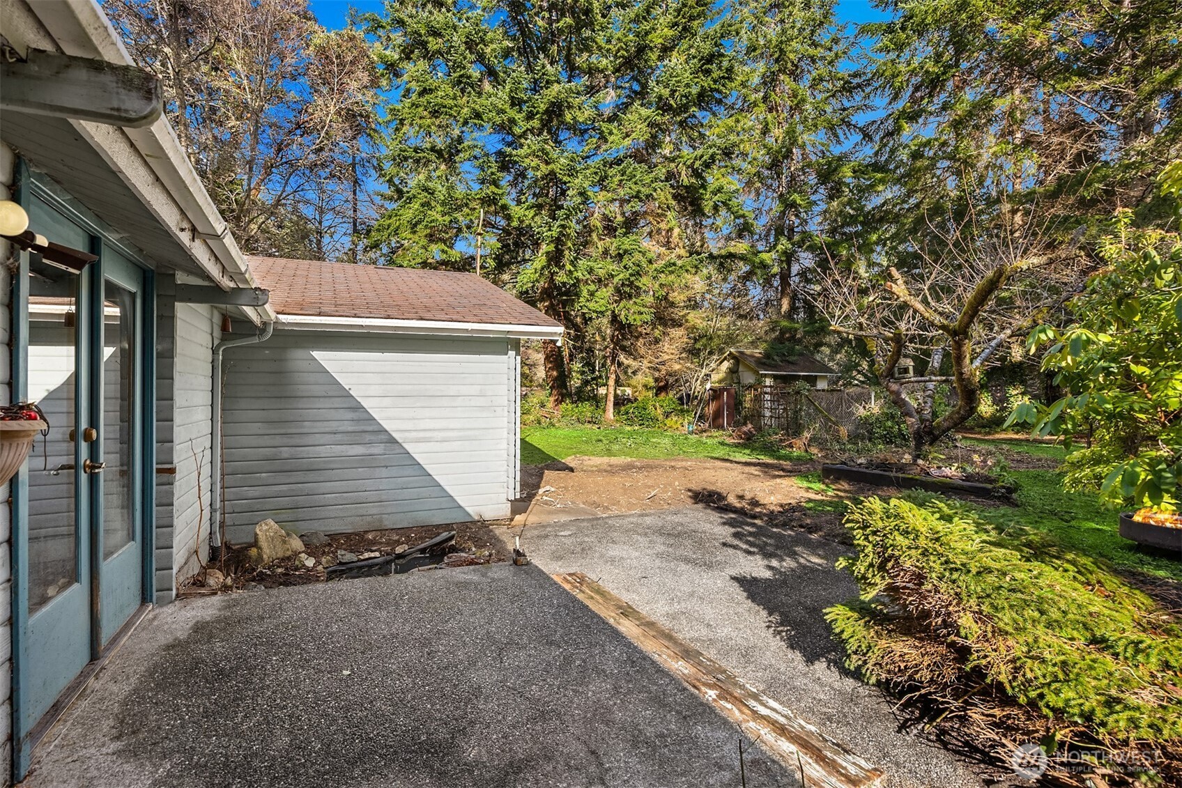 10862 Falk Road Northeast Bainbridge Island, WA 98110 - Photo 5 of 34 a pathway of a house with a yard