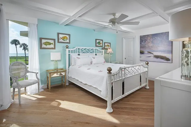 a bedroom with a bed and a table in it