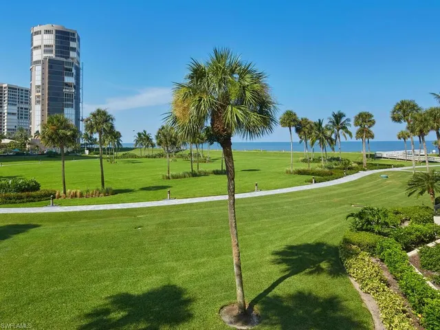 a view of a golf course with a lake