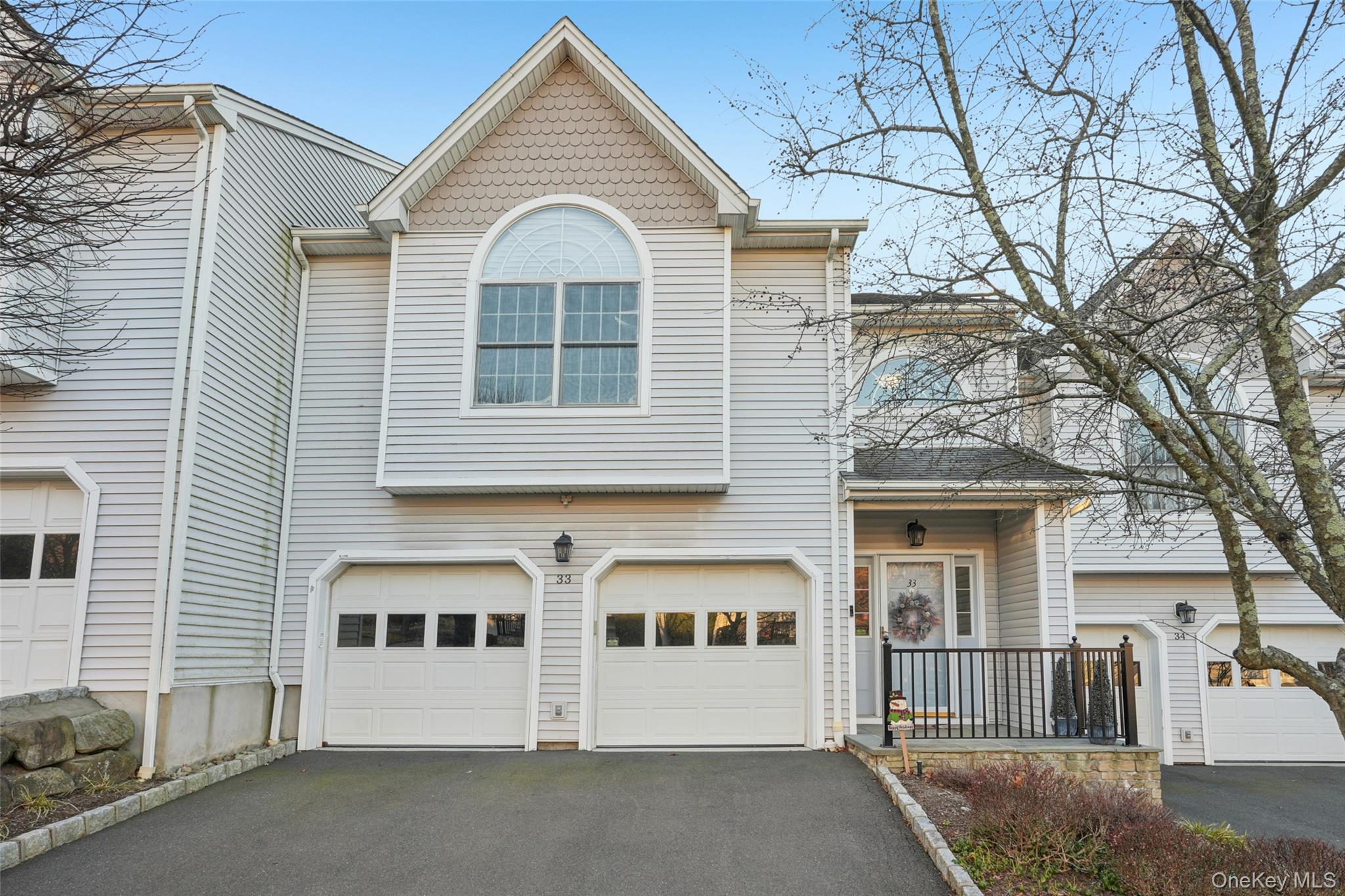 View of front of house featuring driveway and a garage