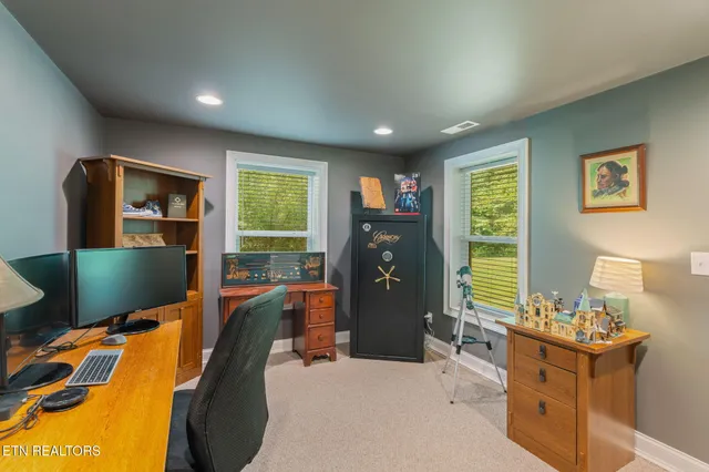 a bedroom with furniture and a window