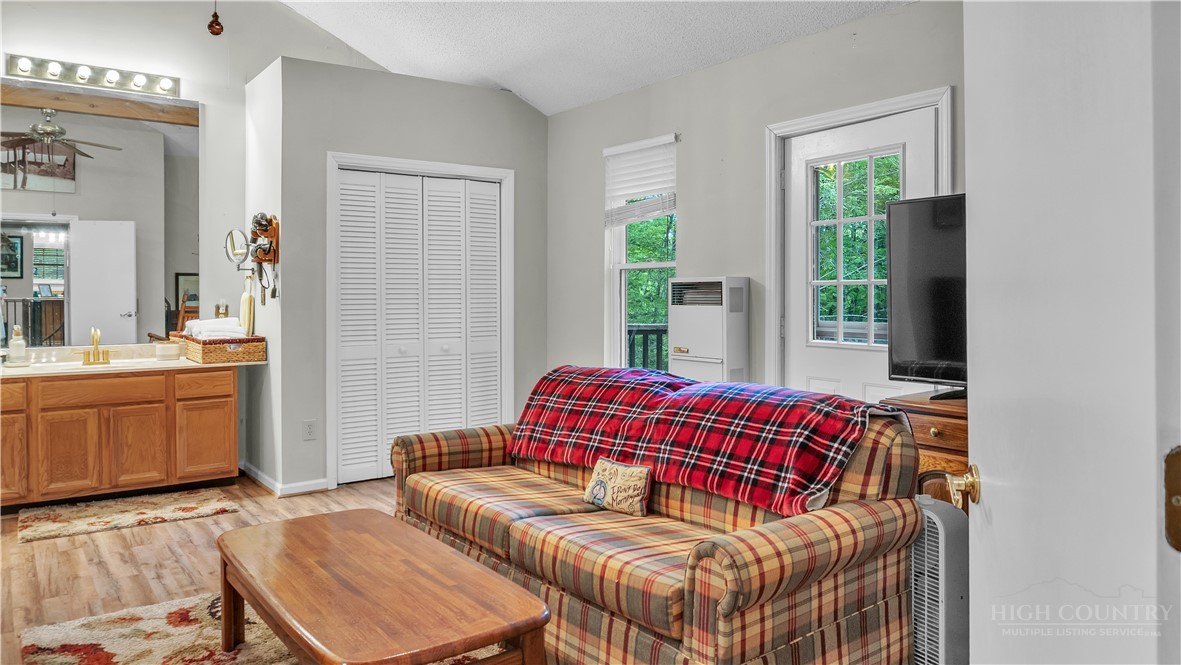 117 Rhododendron Drive Beech Mountain, NC 28604 - Photo 32 of 33 a living room with furniture and a large window