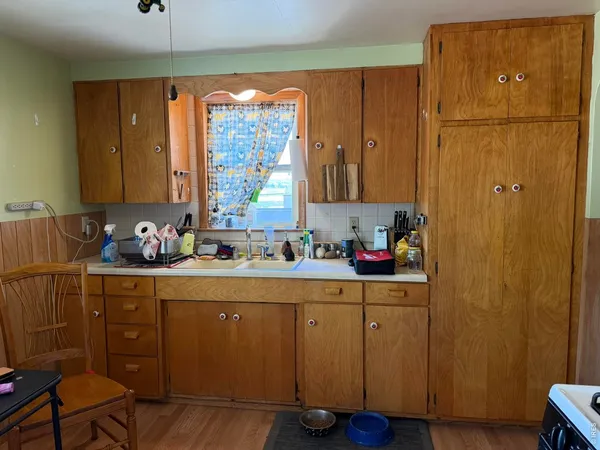a kitchen with a sink and cabinets