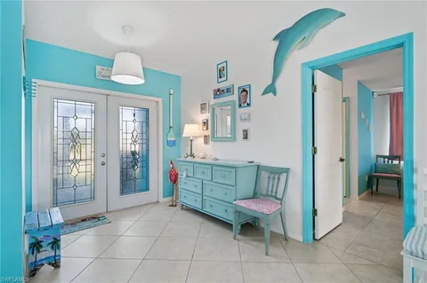 a bathroom with a sink mirror and window