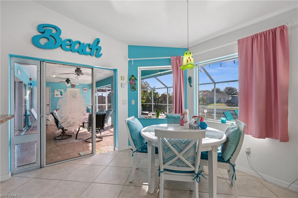 1408 Southwest 23rd Street Cape Coral, FL 33991 - Photo 18 of 49 a view of a dining room with furniture window and outside view