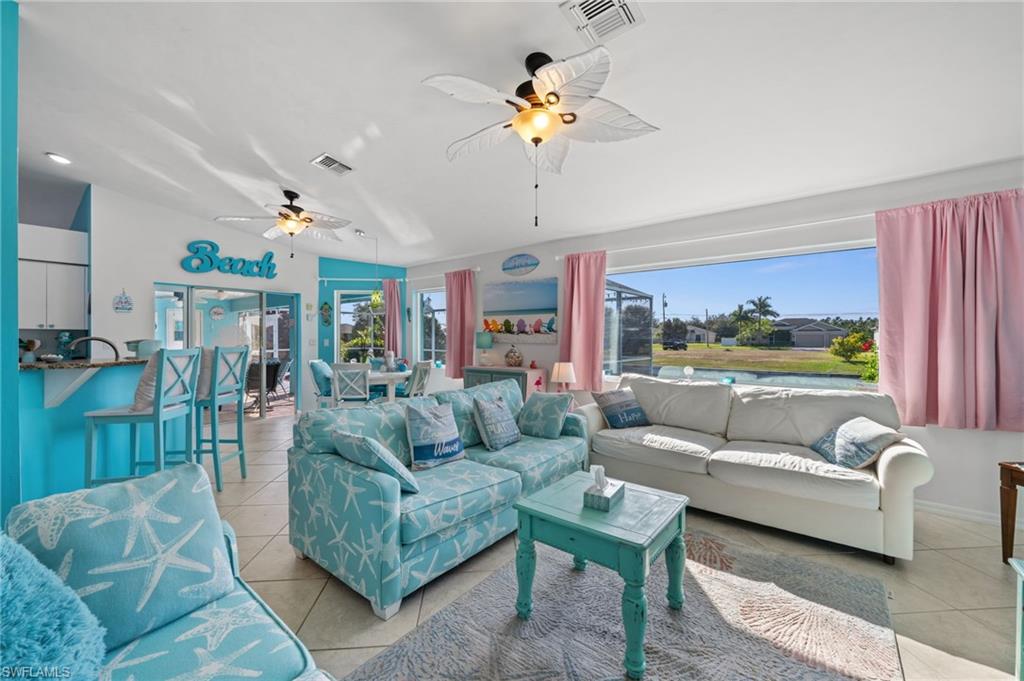 1408 Southwest 23rd Street Cape Coral, FL 33991 - Photo 2 of 49 a living room with furniture and a large window