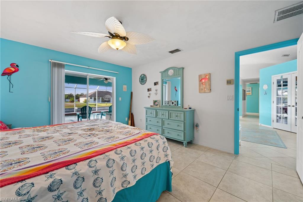 1408 Southwest 23rd Street Cape Coral, FL 33991 - Photo 22 of 49 a bedroom with a bed and a dresser