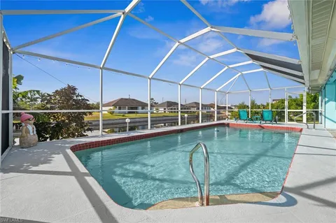 a view of a swimming pool with a patio