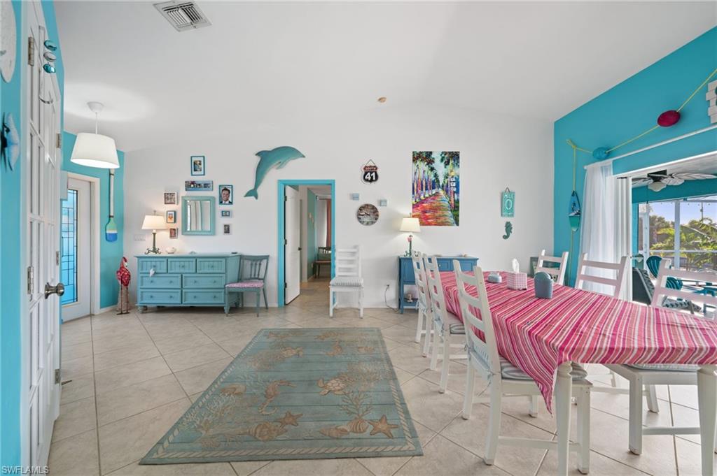 1408 Southwest 23rd Street Cape Coral, FL 33991 - Photo 37 of 49 a living room with furniture and a dining table