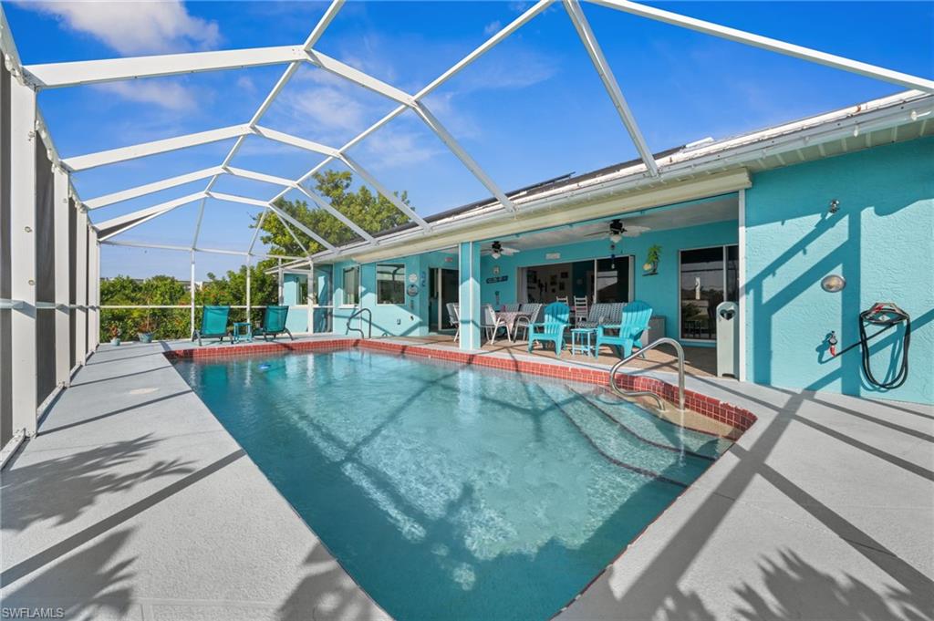 1408 Southwest 23rd Street Cape Coral, FL 33991 - Photo 4 of 49 a view of a patio with swimming pool