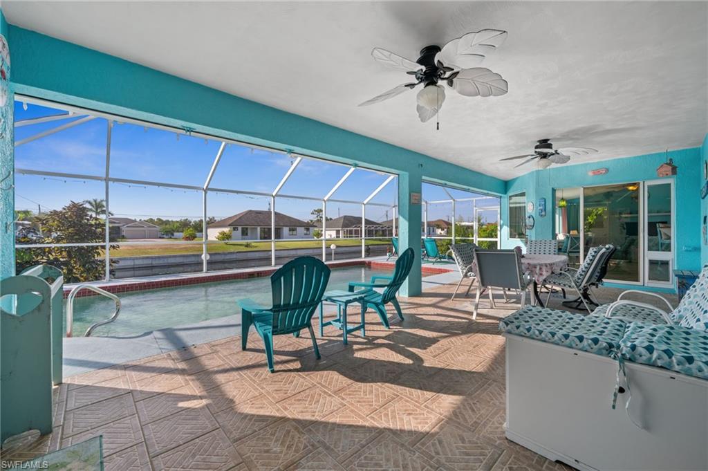 1408 Southwest 23rd Street Cape Coral, FL 33991 - Photo 43 of 49 a view of a patio with a table and chairs