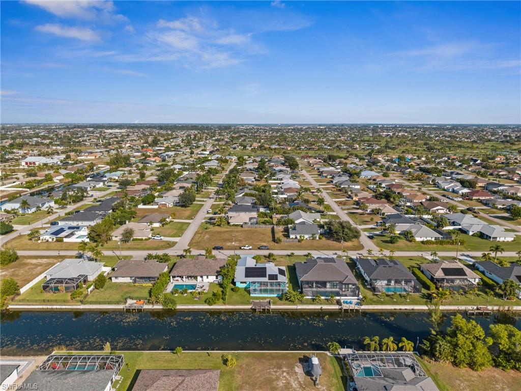 1408 Southwest 23rd Street Cape Coral, FL 33991 - Photo 47 of 49 an aerial view of residential houses with outdoor space