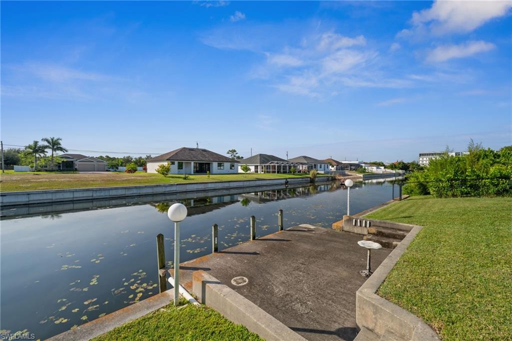 1408 Southwest 23rd Street Cape Coral, FL 33991 - Photo 49 of 49 a view of a lake with a city