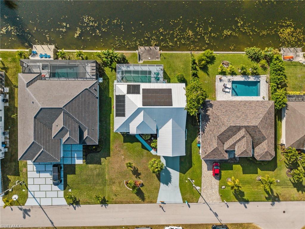 1408 Southwest 23rd Street Cape Coral, FL 33991 - Photo 5 of 49 an aerial view of residential houses with outdoor space and ocean view