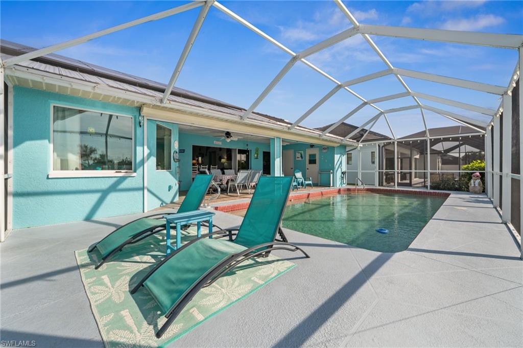 1408 Southwest 23rd Street Cape Coral, FL 33991 - Photo 9 of 49 a view of a swimming pool with a patio