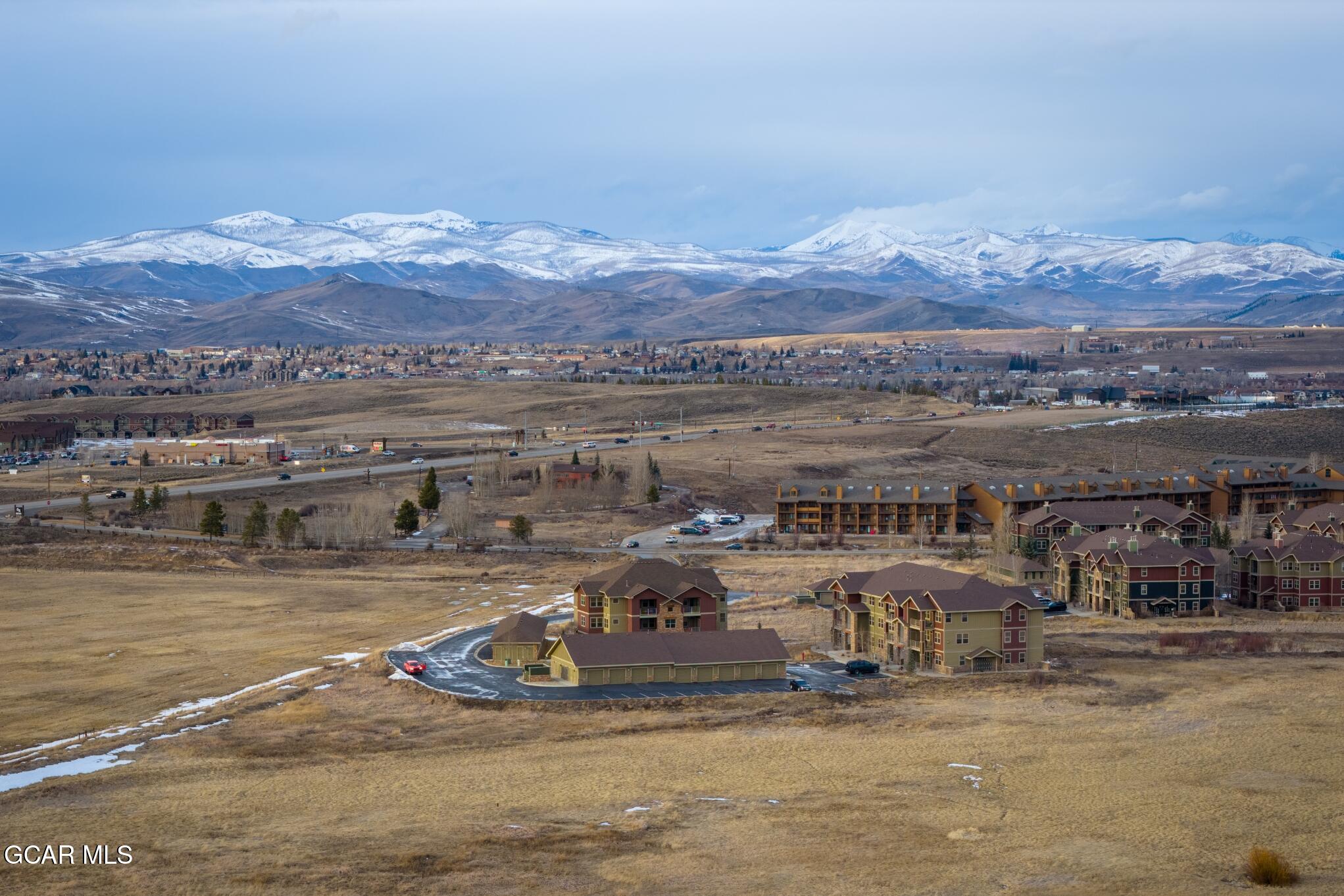 162 Village Road, Unit G303 Granby, CO 80446 - Photo 26 of 37 a view of a lake with a mountain in the background