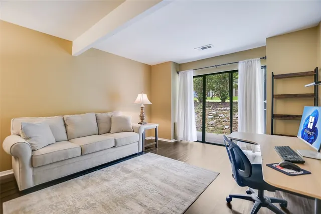 a living room with furniture and a window