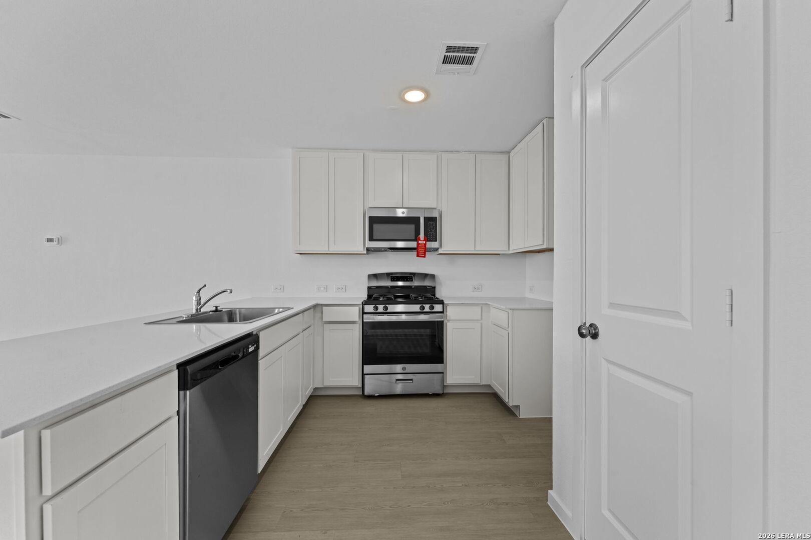 337 Kayden Court Marion, TX 78124 - Photo 14 of 25 a kitchen with a sink and a stove top oven