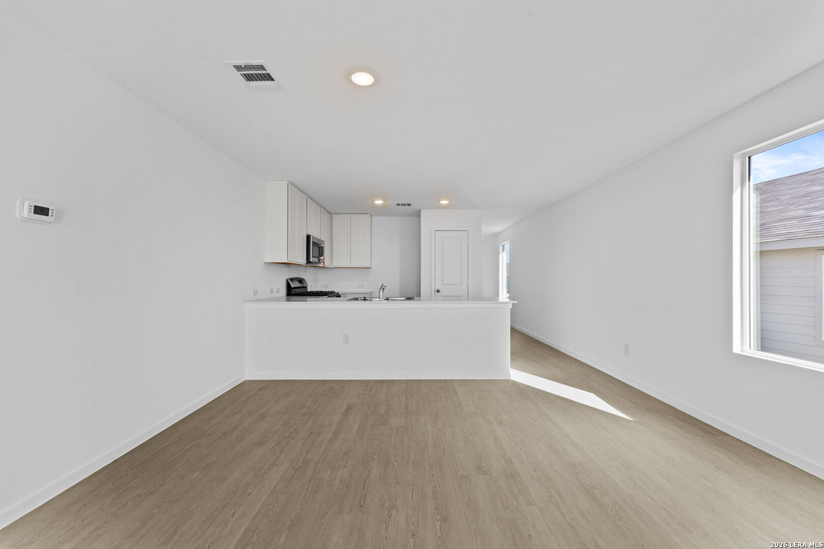 337 Kayden Court Marion, TX 78124 - Photo 18 of 25 a view of kitchen with wooden floor and window