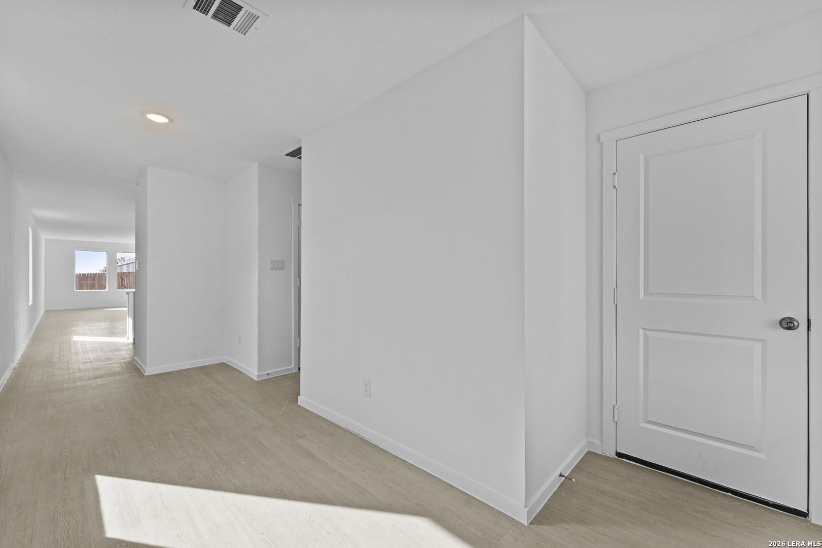 337 Kayden Court Marion, TX 78124 - Photo 2 of 25 a view of a hallway to an empty room and wooden floor