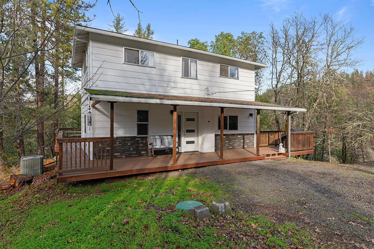 2900 Indian Creek Road Shady Cove, OR 97539 - Photo 27 of 35 a front view of a house with garden