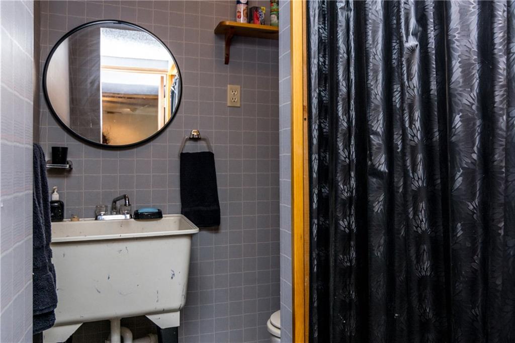 186 Old English Road Pittsburgh, PA 15237 - Photo 21 of 24 Lower level half bath with toilet and utility sink.