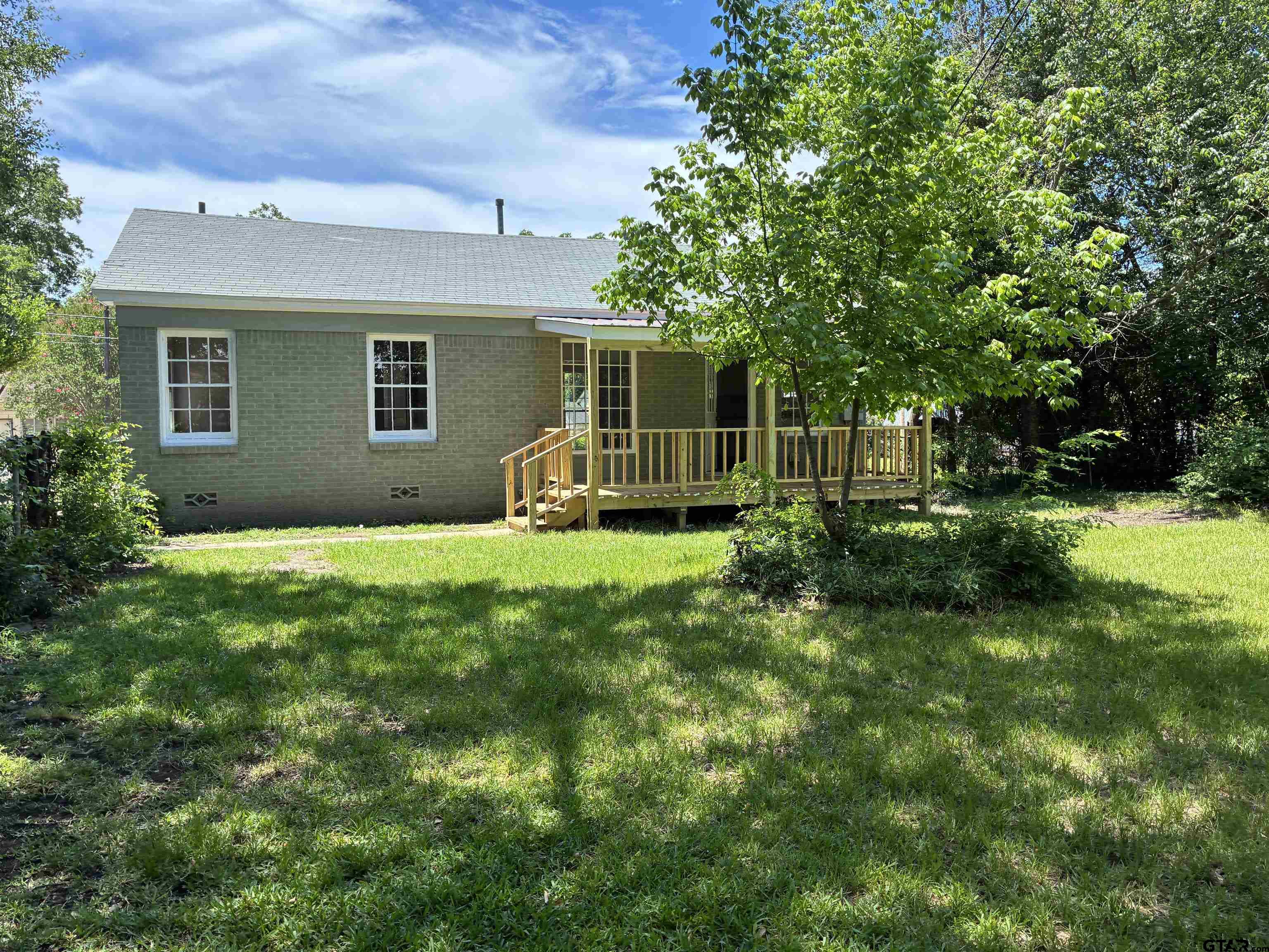 811 West 5th Street Tyler, TX 75701 - Photo 21 of 26 a view of a house with backyard and garden