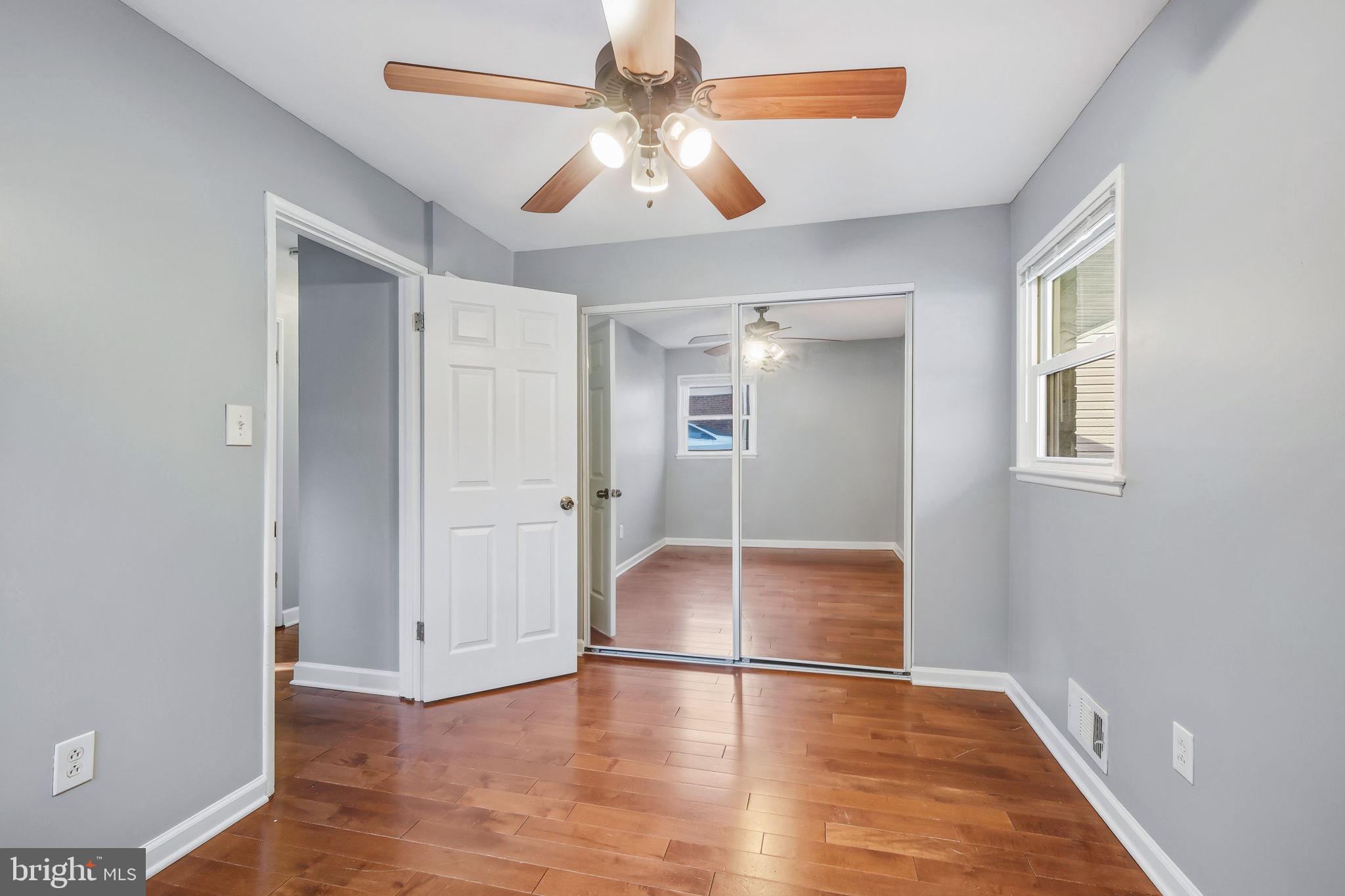 8817 Lagrange Street Lorton, VA 22079 - Photo 21 of 47 wooden floor in an empty room with a window