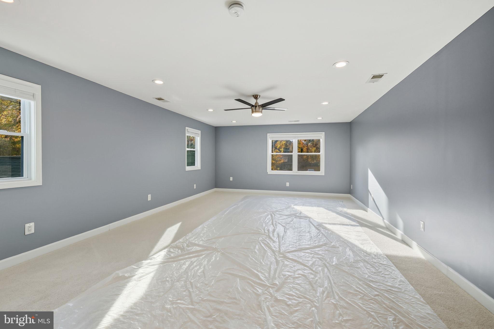 8817 Lagrange Street Lorton, VA 22079 - Photo 23 of 47 a view of a livingroom with a ceiling fan and window